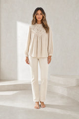 Blouse à col volanté et manches bouffantes