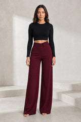 High-waisted flowing trousers with crossover belt