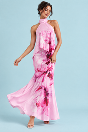 Jupe longue asymétrique rose à imprimé floral en satin mat | Vue en mouvement | Lounelle Paris