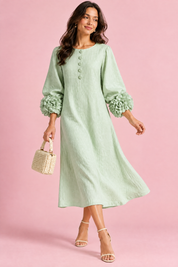 Robe midi vert menthe coupe trapèze à manches bouffantes | Vue en mouvement | Lounelle Paris